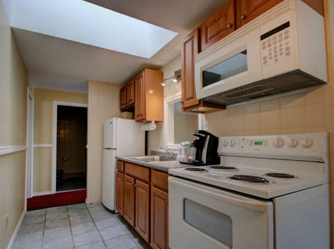 Three-Bedroom Apartment Chalet | Private kitchen | Microwave, coffee/tea maker, cleaning supplies
