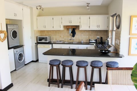 Apartment, 3 Bedrooms | Private kitchen | Full-size fridge, microwave, oven, stovetop