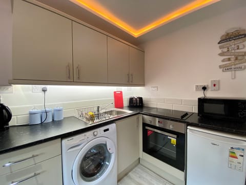 Kennedy House, 2 Bed, Ground Floor | Private kitchen | Full-size fridge, microwave, stovetop, coffee/tea maker