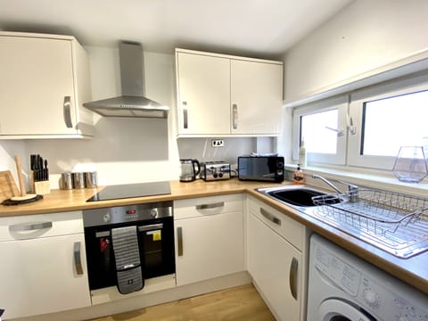 Kennedy House, 2 Bed Penthouse | Private kitchen | Full-size fridge, microwave, stovetop, coffee/tea maker