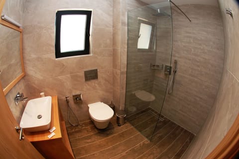 Deluxe Quadruple Room, Sea View | Bathroom | Shower, slippers, bidet, towels