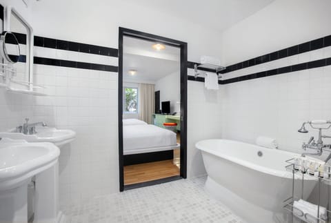 Suite | Bathroom | Designer toiletries, hair dryer, slippers, towels