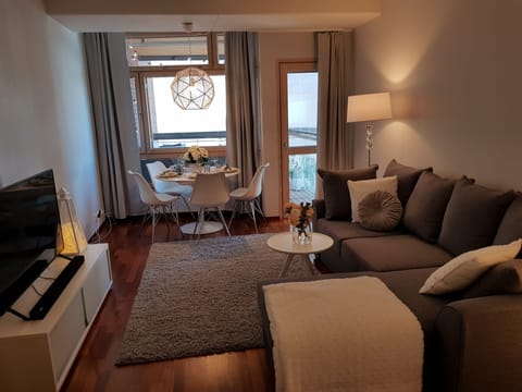 Deluxe Apartment (with Sauna and Balcony) | Living area | Flat-screen TV