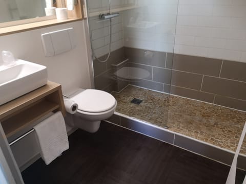 Bathtub, eco-friendly toiletries, hair dryer, towels