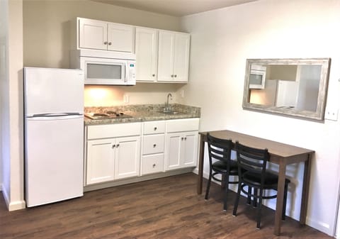 Suite, 2 Queen Beds | Private kitchen | Full-size fridge, stovetop, coffee/tea maker