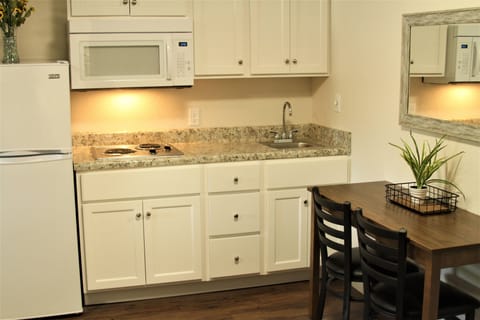 Suite, 2 Queen Beds | Private kitchen | Full-size fridge, stovetop, coffee/tea maker