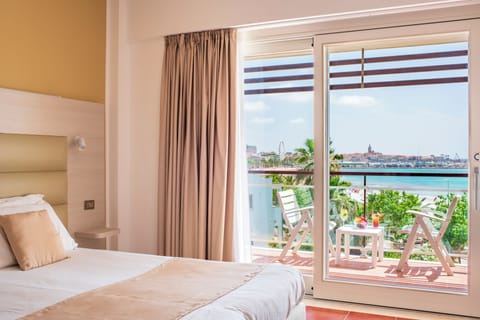 Double Room Sea/Pool View | Minibar, in-room safe, desk, laptop workspace