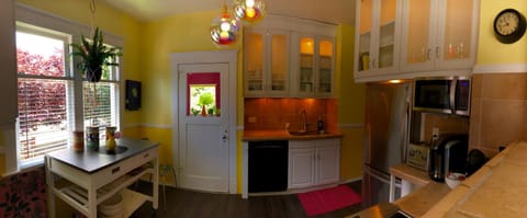 The kitchen with lit up cabinets.