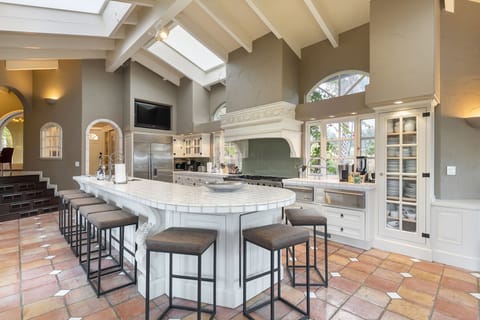 Seating wraps around the counter for gathering in the kitchen