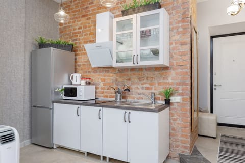 Design Apartment, Sauna, City View (Kirova 1) | Private kitchenette | Full-size fridge, microwave, stovetop, electric kettle