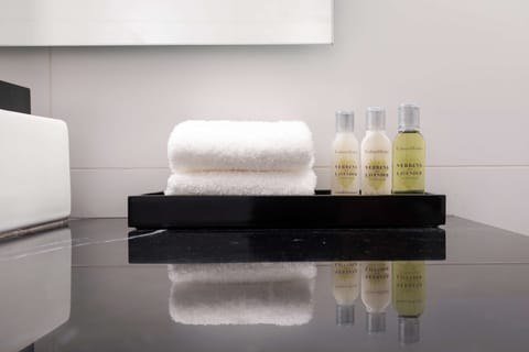 Combined shower/tub, designer toiletries, hair dryer, bathrobes