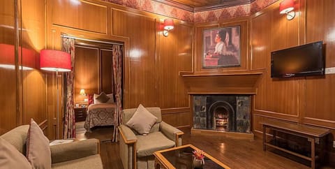 British Suite Room With Fireplace | Living area