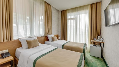 Economy Double or Twin Room | 1 bedroom, premium bedding, minibar, in-room safe