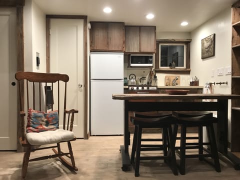 Bathroom door, closet, fridge, stove/oven, sink, dining table.  Enjoy!
