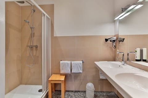 Junior Suite, Patio, Lake View | Bathroom | Shower, hair dryer, heated floors