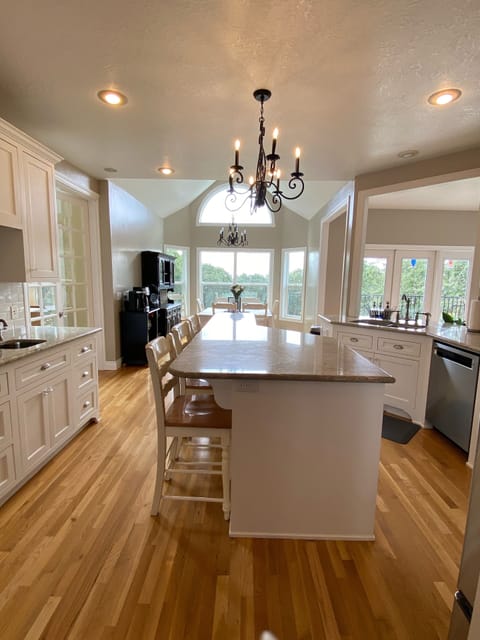 Beautiful clean and bright kitchen with views. Table & island that seats 11