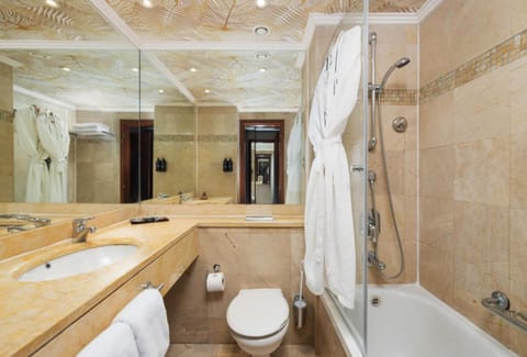 Brown Suite | Bathroom | Bathtub, hair dryer, towels