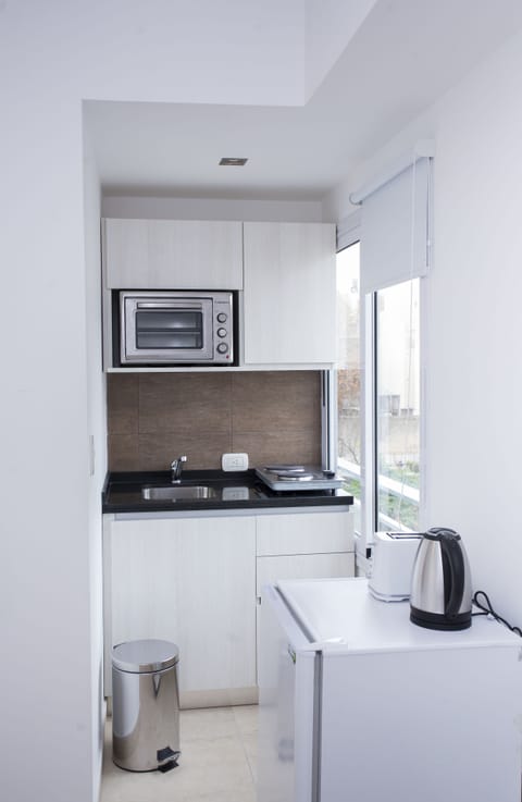 Standard Apartment | Private kitchenette | Fridge, stovetop, cookware/dishes/utensils