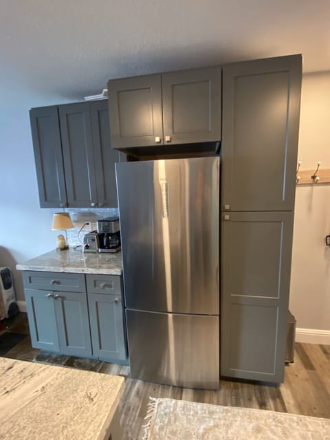 Full size refrigerator with large freezer and pantry next to it