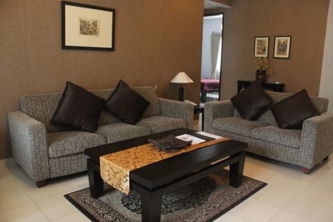 Family Suite, 2 Bedrooms | Living room | LED TV