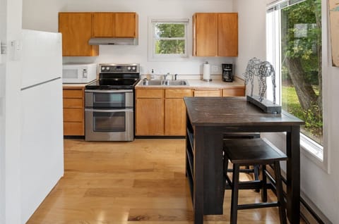 Kitchen area in 7th bedroom with door to outside.