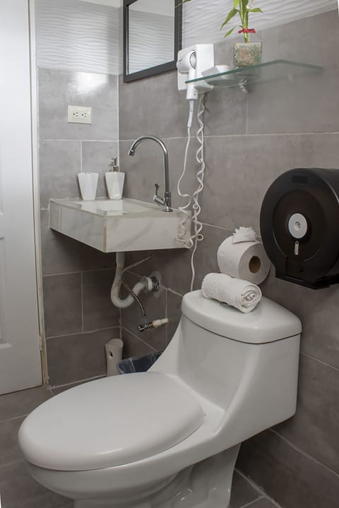 Standard Shared Dormitory | Bathroom | Shower, rainfall showerhead, hair dryer, slippers