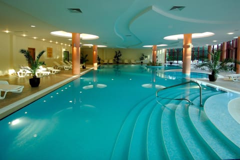 Indoor pool, seasonal outdoor pool, pool umbrellas, sun loungers