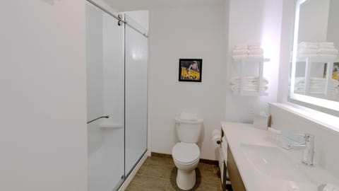 Standard Room, 2 Queen Beds, Refrigerator | Bathroom | Rainfall showerhead, designer toiletries, hair dryer, towels