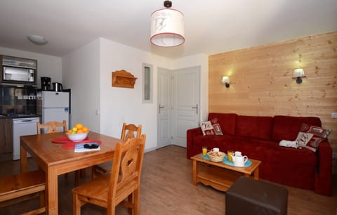 Relax in the open-concept living space which adjoins with the dining area. The lay out may vary slightly from the photos.