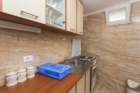 Apartment (One-Bedroom Apartment with Shared Ter) | Private kitchen | Fridge, oven, stovetop, electric kettle