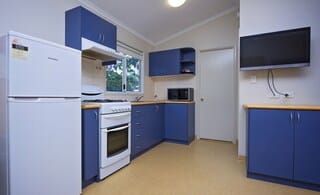 Standard 1 Bedroom Cabin | Private kitchen | Fridge, microwave, stovetop, cookware/dishes/utensils