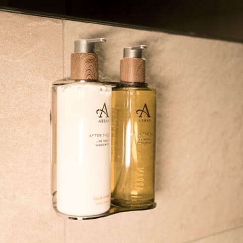 Designer toiletries, hair dryer, towels, soap