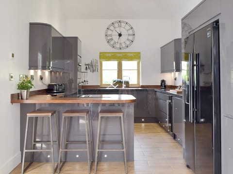 Well-equipped kitchen with breakfast bar | Manor Lodge Stables, Wiston, near Haverfordwest