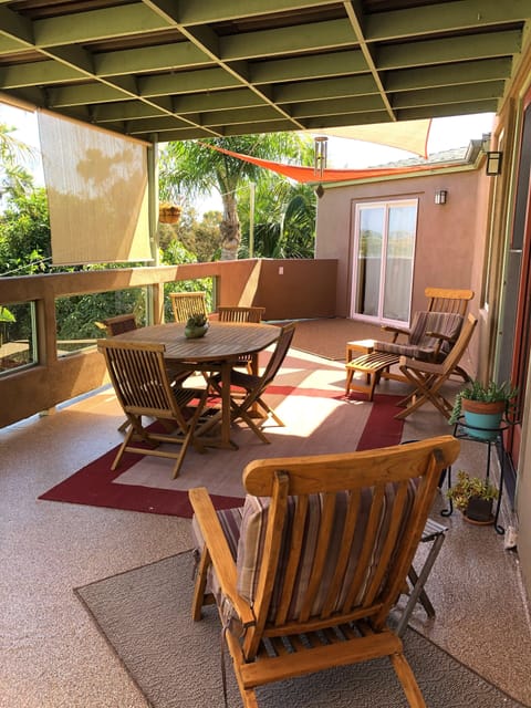 Deck is accessible from the living room and kitchen areas.