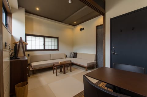 Tanuki Studio Apartment L4 | Living area | Flat-screen TV, heated floors