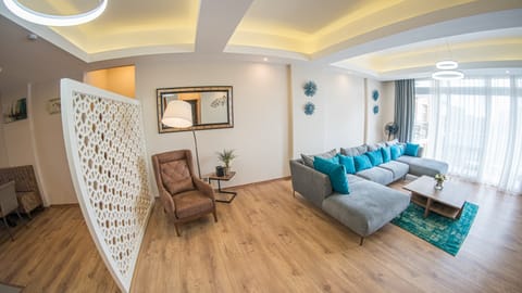 Apartment, 3 Bedrooms | Living area | Flat-screen TV