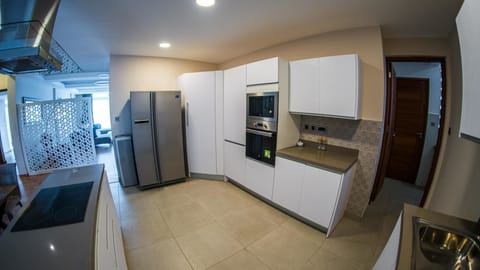 Apartment, 3 Bedrooms | Private kitchen | Fridge, microwave, oven, stovetop