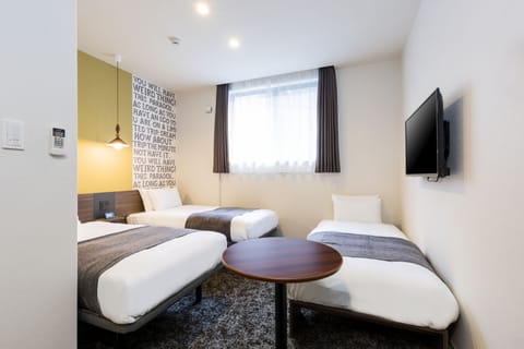 Twin Room with Sofa Bed | In-room safe, iron/ironing board, free WiFi, bed sheets