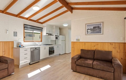 Deluxe Riverview Cabin | Private kitchen | Fridge, microwave, stovetop, cookware/dishes/utensils