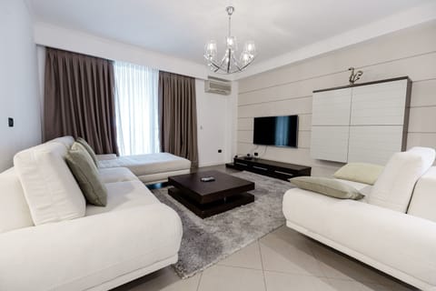 Superior Apartment | Living area | Flat-screen TV