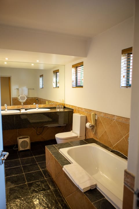 Suite | Bathroom | Separate tub and shower, designer toiletries, hair dryer, bathrobes