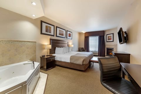 Suite, 1 King Bed, Non Smoking, Jetted Tub | In-room safe, desk, laptop workspace, iron/ironing board