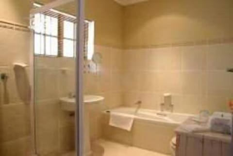 Separate tub and shower, deep soaking tub, hair dryer, towels