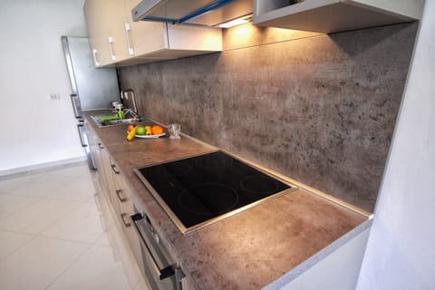 Deluxe Apartment | Private kitchen | Fridge