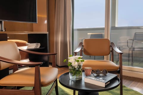 Junior Double Room | Living area | 82-cm LCD TV with satellite channels, TV, iPod dock