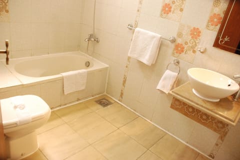 Separate tub and shower, deep soaking tub, hair dryer, towels