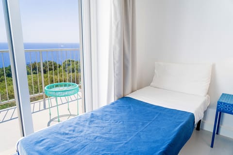 Family Quadruple Room, Sea View | Minibar, in-room safe, individually decorated, desk