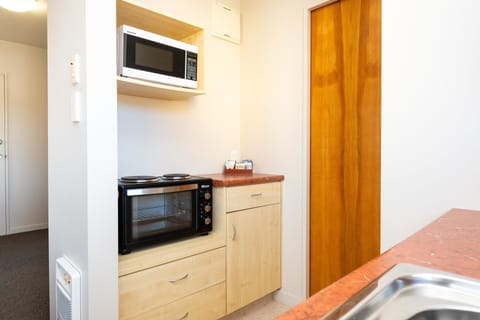 One Bedroom Unit | Private kitchen | Fridge, microwave, coffee/tea maker, electric kettle