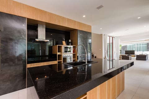 Luxury Villa | Private kitchen | Full-size fridge, microwave, oven, stovetop