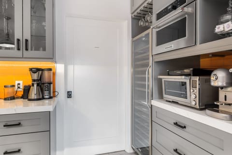 Extras like a Nespresso machine, wine fridge, and toaster oven